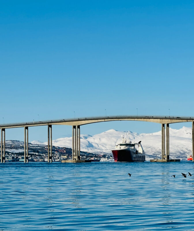 On Tromsø fjord boat tour we go under Tromsø bridge.