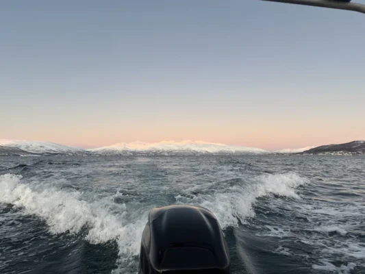 Clear winter sky in Arctic viewed from a moving boat near Tromsø