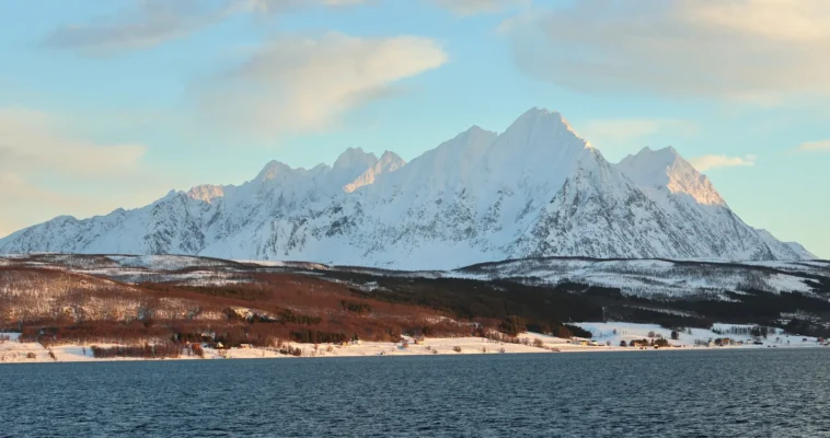 Panoramic view of the Lyngen Alps and Arctic coastline in winter light near Tromsø