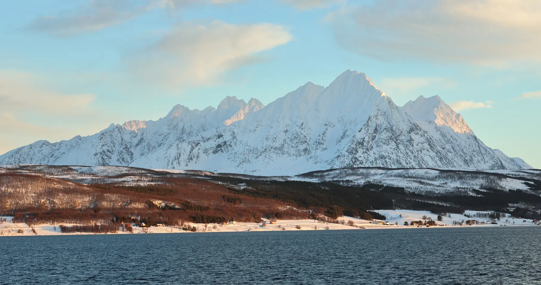 Panoramic view of the Lyngen Alps and Arctic coastline in winter light near Tromsø