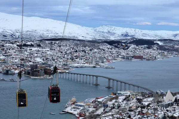 Cable carts over the view of Tromsø bridge, Arctic cathedral and city itself