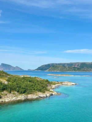 Vibrant turquoise waters and rocky islands seen from Sommarøy, Tromsø, Norway.