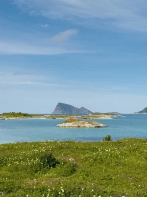 Stunning view of mountain and turquoise waters from Sommarøy, Tromsø, Norway.