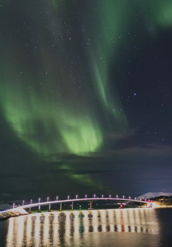Northern Lights above a bridge near Tromsø during a private Northern Lights tour