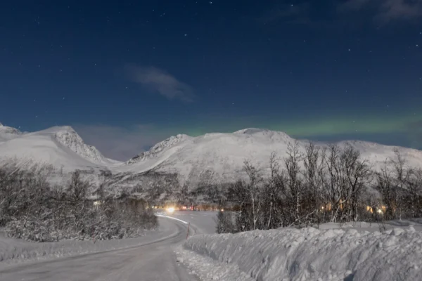 Winter mountain road near Tromsø during a private Northern Lights tour